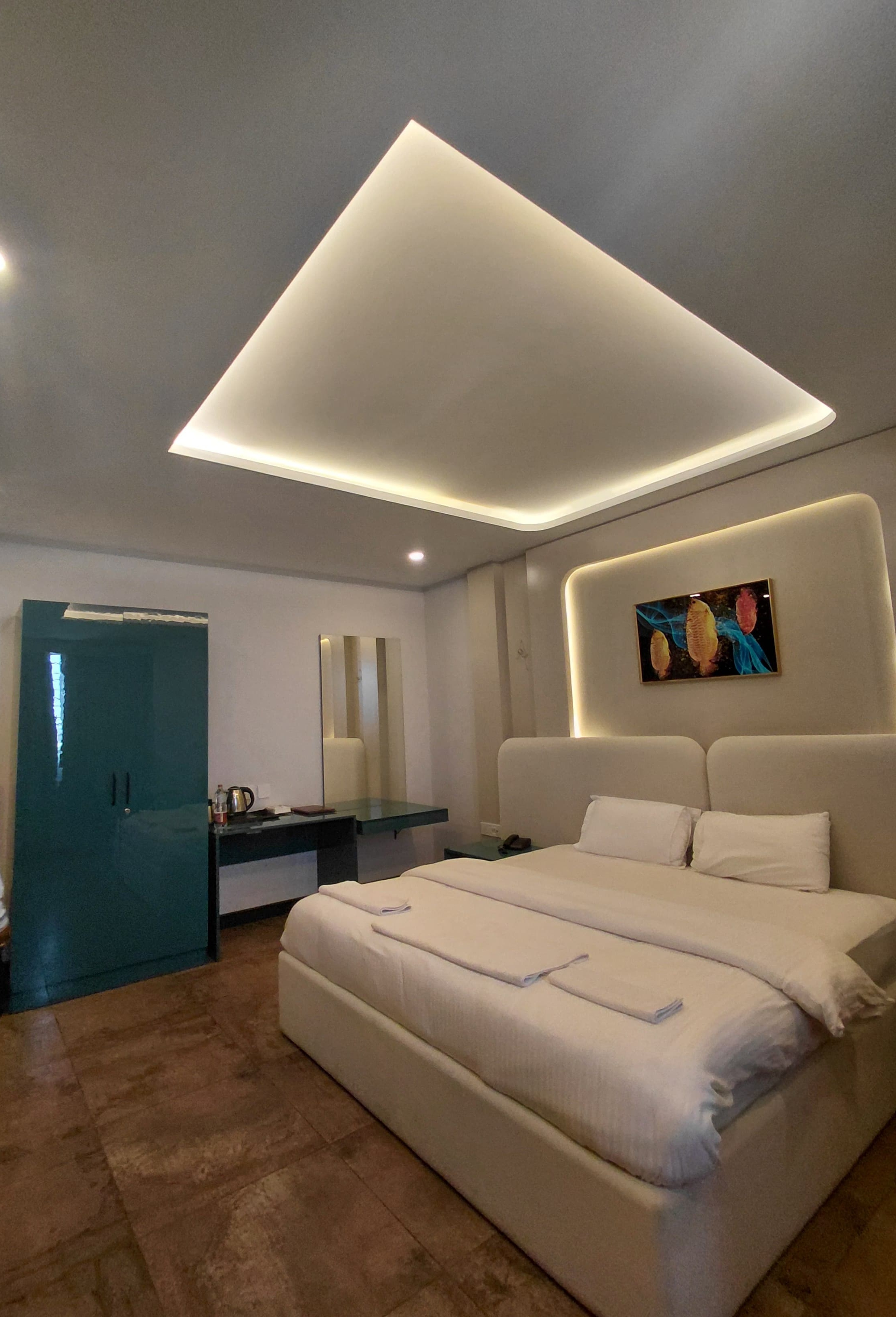 Luxury room view with designer bathroom entrance and elegant ceiling lighting